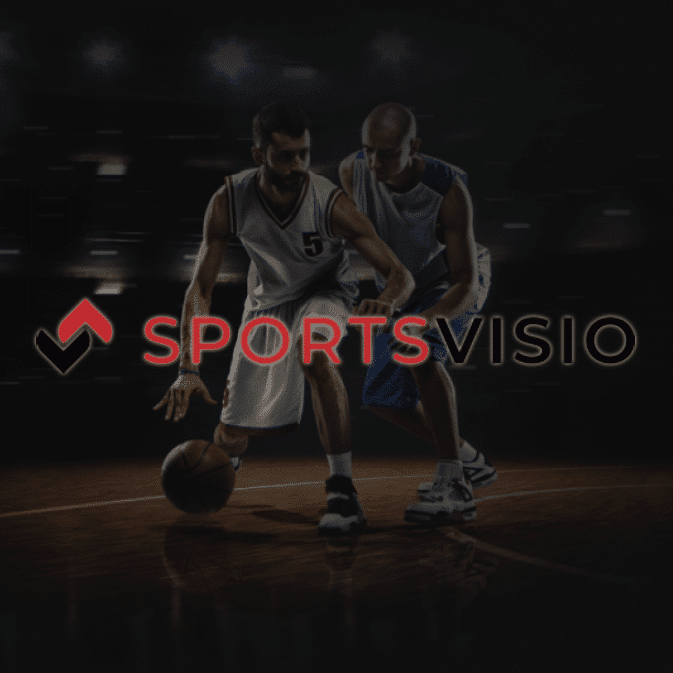 2 basketball players playing on a court. Sports Visio Logo is in front